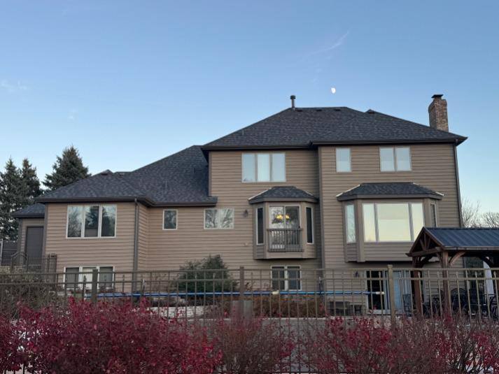 Black Gutters installed by GutterForge on a residential roofline
